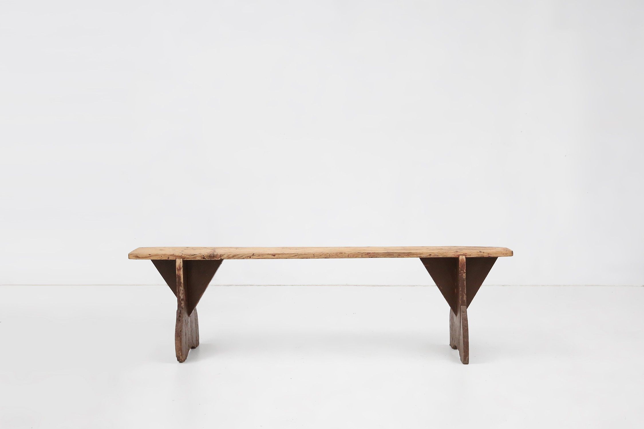 Rustic wooden bench in with brown painted feet, France ca. 1890thumbnail
